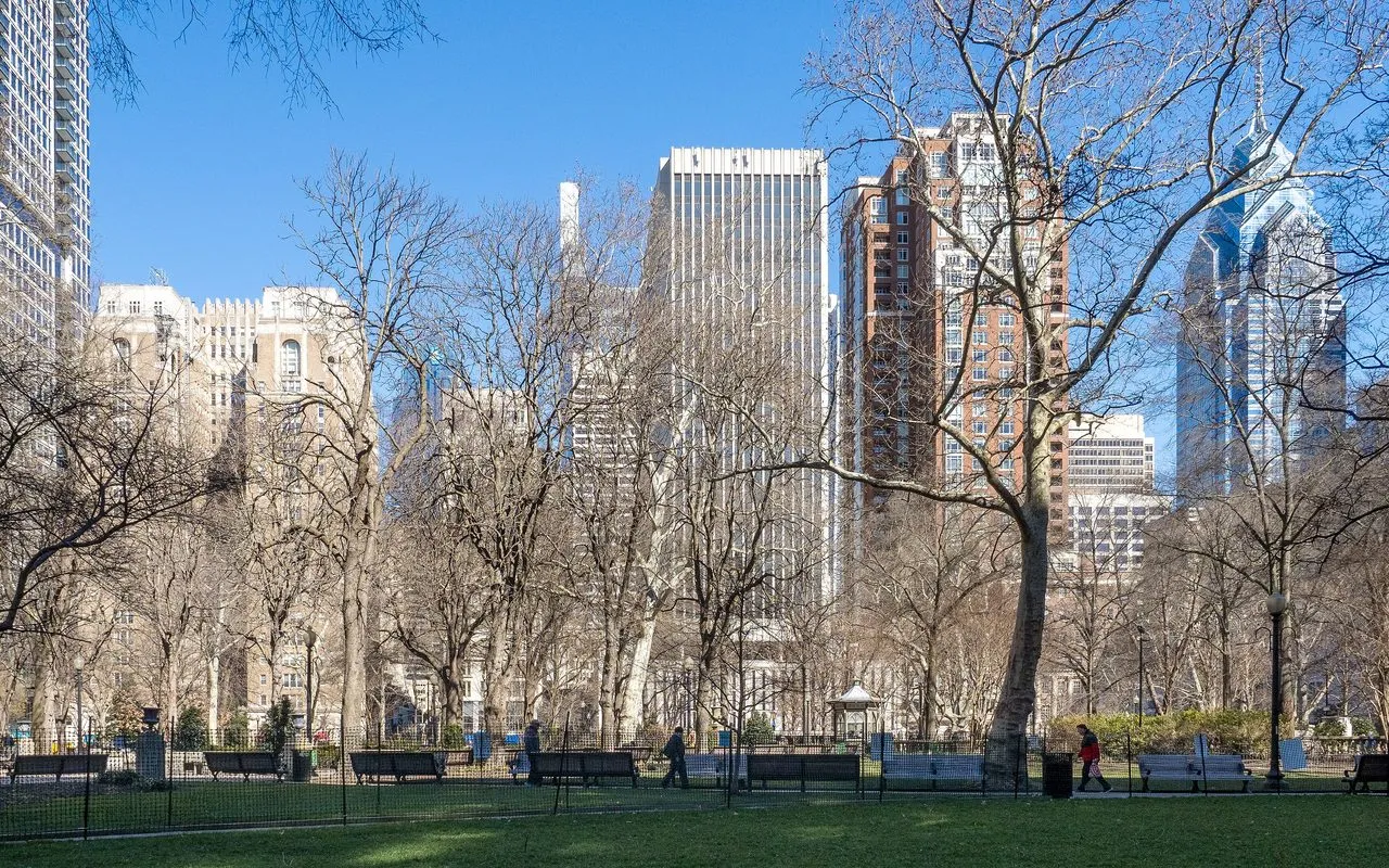 Rittenhouse Square in early spring, with apartment and office towers rising behind its bare trees