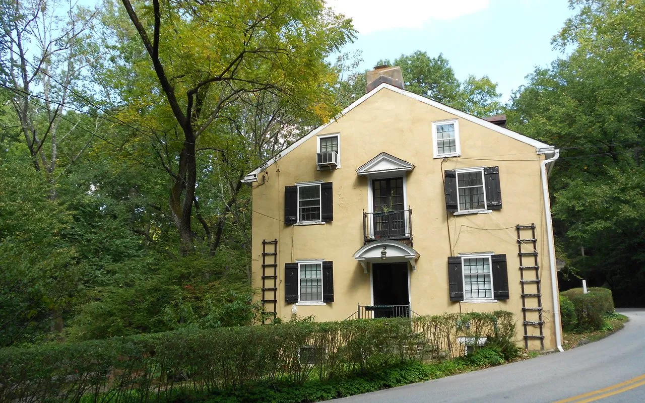 A historic house on a wooded lane in the Mill Creek district