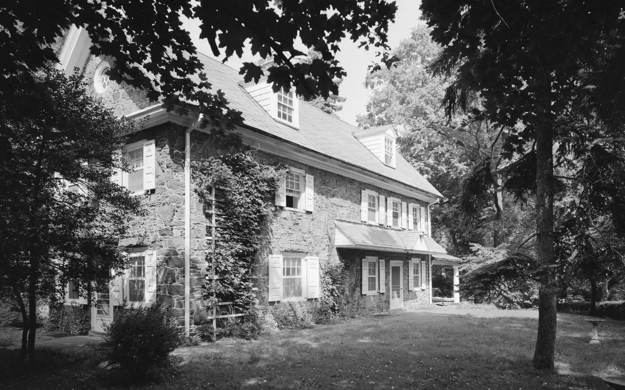 Wynnestay, Thomas Wynne’s 1689 stone house on Woodbine Avenue, framed by trees